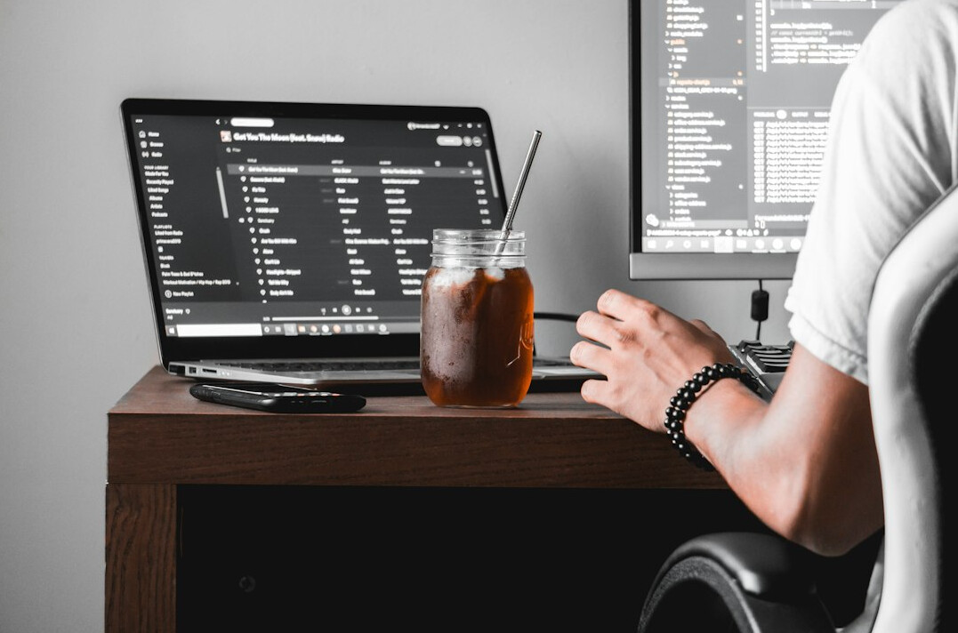 insurance programmer at desk